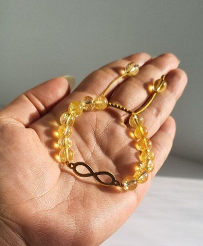 دستبند تک سنگ سیترین با پلاک بینهایت